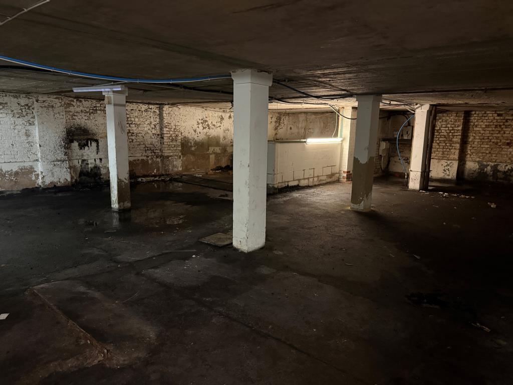 Lot: 24 - FORMER SHOWROOM WITH DEVELOPMENT POTENTIAL (STNC) - View of lower ground floor from rear